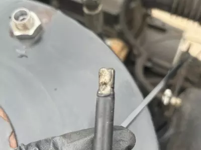 Warped and damaged photocell flame sensor from Nilfisk Contractor diesel hot pressure washer burner.